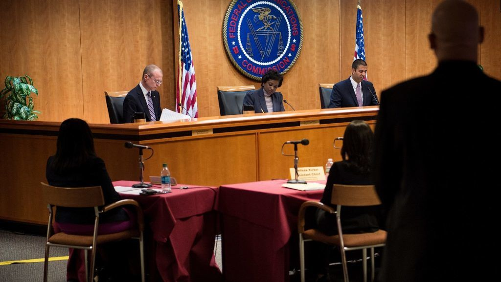 A vote to repeal Net Neutrality protections is conducted during a hearing at the Federal Communications Commission December 14, 2017 in Washington, DC. / AFP PHOTO / Brendan Smialowski